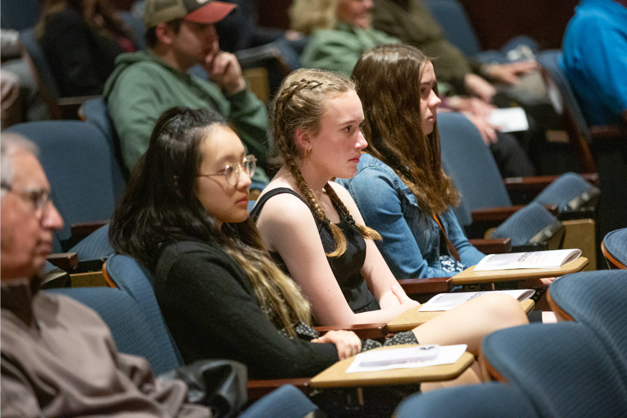 Students listen during an event.